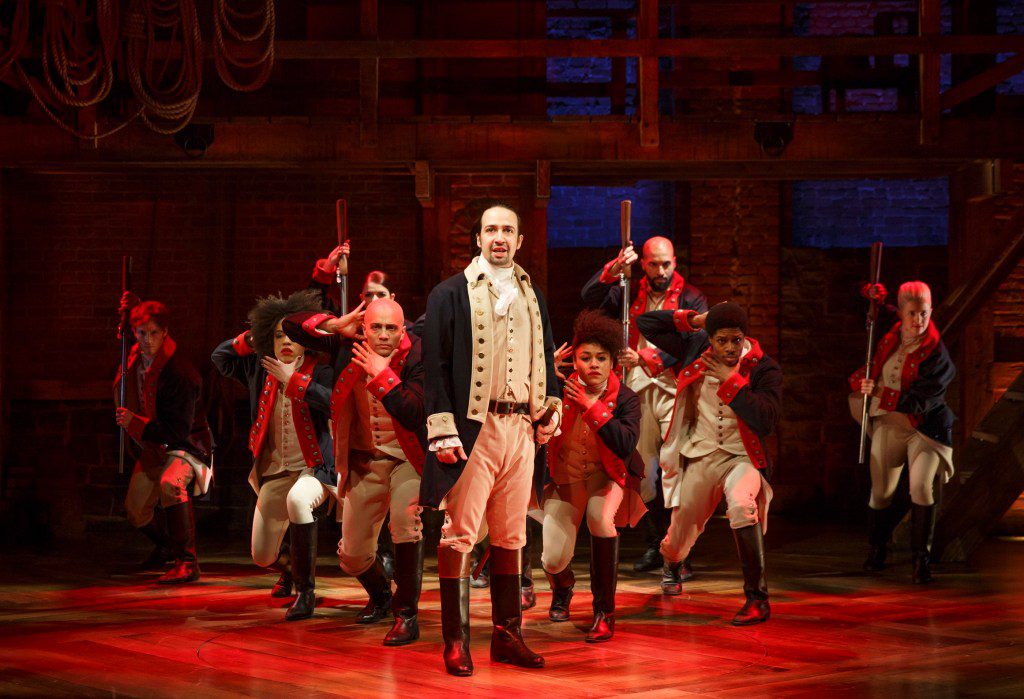 In this photo released by the public theater, Lin-Manuel Miranda, a center, works in music "Hamilton" In the public theater in New York.